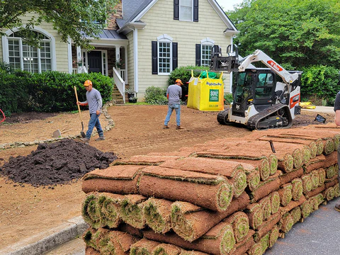 Sod installation crew preparing a residential yard